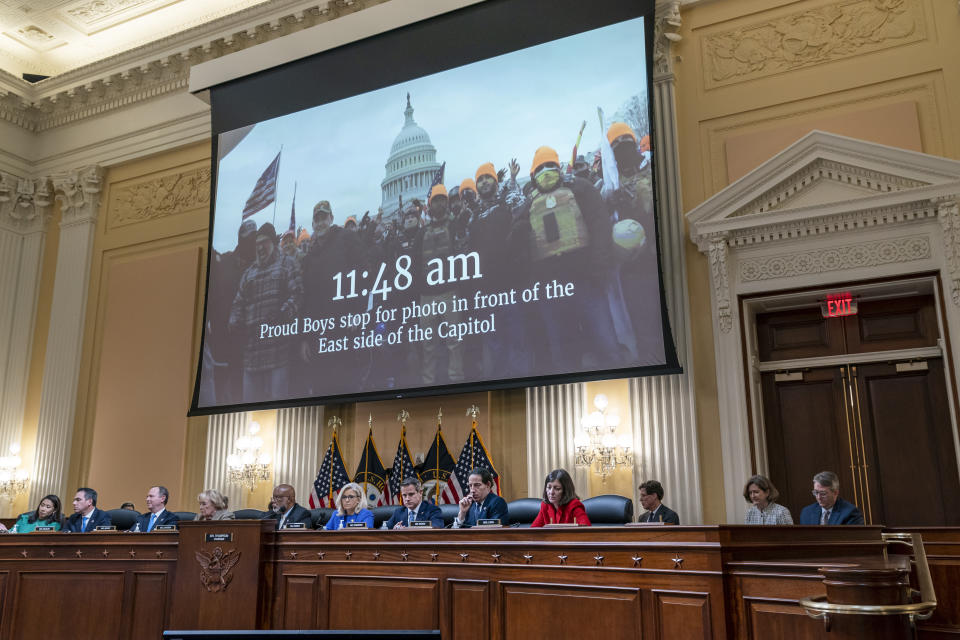 FILE - A video is displayed by the committee that claims to shows= Proud Boys in front of the Capitol on Jan. 6, 2021, as the House select committee investigating the Jan. 6 attack on the U.S. Capitol a hearing at the Capitol in Washington, June 9, 2022. An upcoming hearing of the U.S. House Committee probing the Jan. 6 insurrection is expected to examine ties between people in former President Donald Trump's orbit and extremist groups who played a role in the Capitol riot. (AP Photo/J. Scott Applewhite, File)