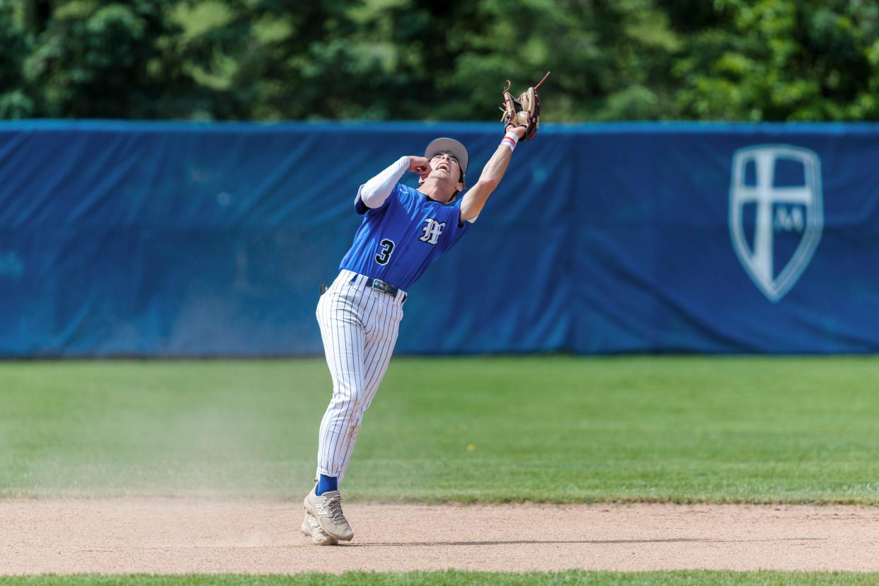 Marian's John Oliver (3) records the putout during the Marian-Saint Joseph high school 3A sectional baseball championship game on Monday, May 29, 2023, at Marian High School in Mishawaka, Indiana.