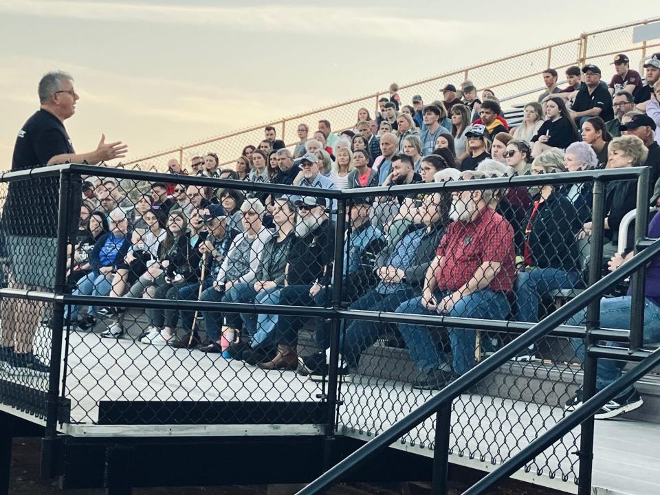 A close friend of Riley Strain's family, Chris Dingman, speaks at Wednesday's vigil at Kickapoo High School. Strain, a Mizzou student, went missing in Nashville after a night out with fraternity brothers.