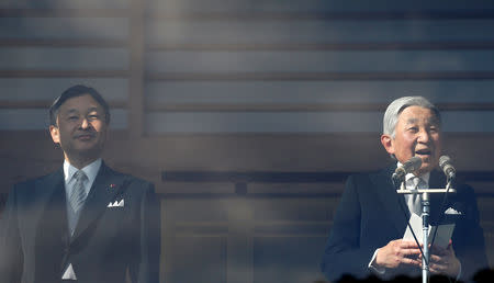 FILE PHOTO : Japanese Emperor Akihito (R) makes a speech as Crown Prince Naruhito stands next to him during a public appearance for New Year celebrations at the Imperial Palace in Tokyo, Japan, January 2, 2017. REUTERS/Kim Kyung-Hoon/File Photo