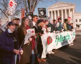 Abortion opponents march in front of the Supreme Court in Washington Monday Jan. 22, 1996 during their 23rd annual march against the court's decision to legalize abortion. The group used this year's protest to urge President Clinton to sign legislation limiting a woman's right to abortion. (AP Photo/Doug Mills)