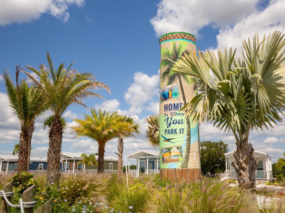 Palm trees among a Margaritaville sign.