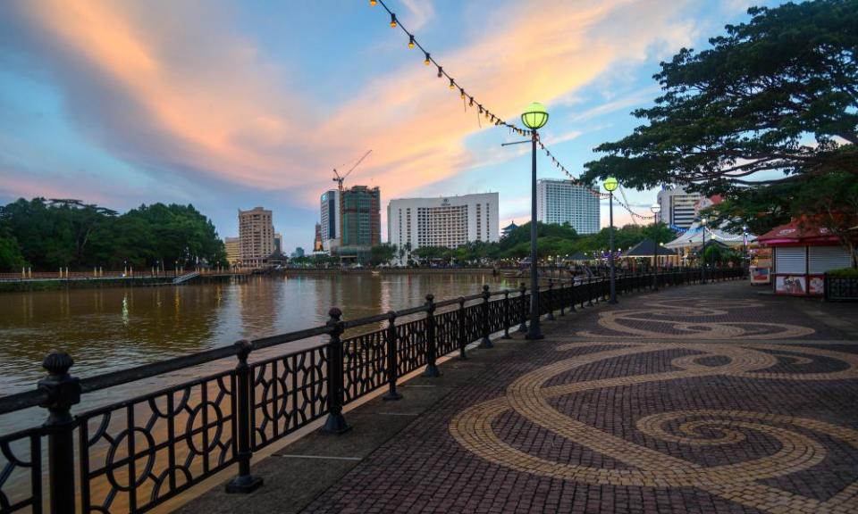 Kuching city waterfront at sunset.