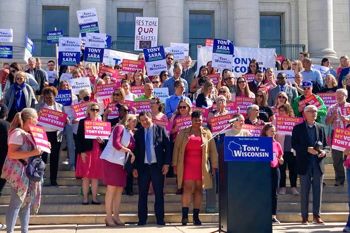 Abortion rights supporters, including Gov. Tony Evers (right), rally outside the Wisconsin State Capitol in Madison after the Republican-controlled Legislature refused to act on a measure to create a pathway for voters to decide on whether to keep the state's 1849 abortion ban on Oct. 4, 2022.