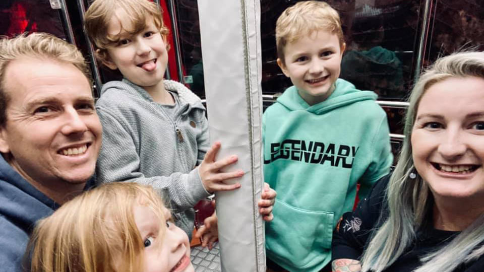 Luke (Left) and Angie Mansey (right) with their three children