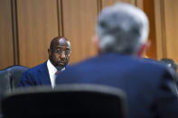 Sen. Raphael Warnock, D-Ga., questions Federal Reserve Chairman Jerome Powell during a Senate Banking, Housing and Urban Affairs Committee hearing on the CARES Act on Capitol Hill, Tuesday, Sept. 28, 2021 in Washington. (Matt McClain/The Washington Post via AP, Pool)