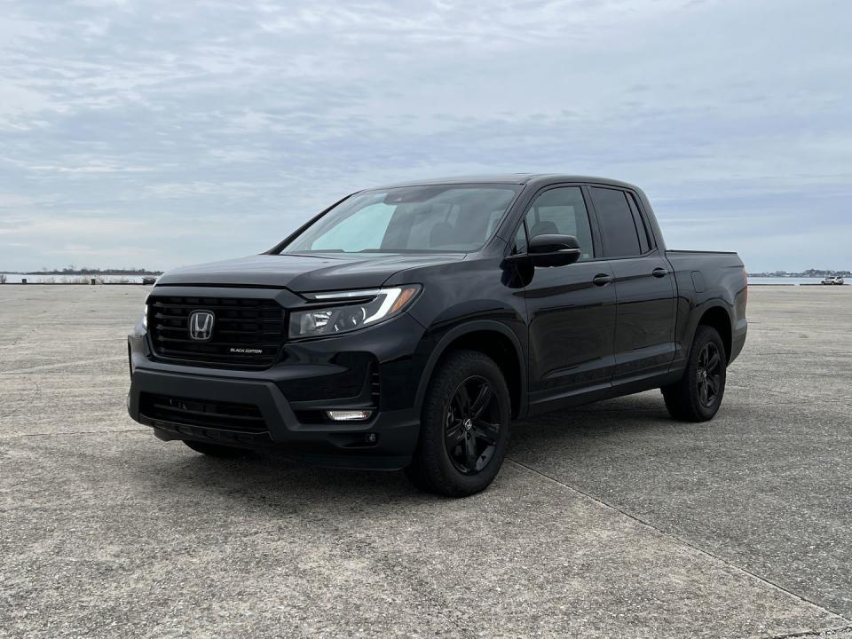 <p>The 2023 Ridgeline's looks can be polarizing, seeing as how it looks nearly identical to a Honda Passport from the rear firewall forward. It's a bit awkward from some angles, and doesn't look like a traditional truck.</p><p>The Black Edition trim you see here alleviates a bit of that awkwardness, with a blacked-out grille, black exterior trim, and black wheels.</p>