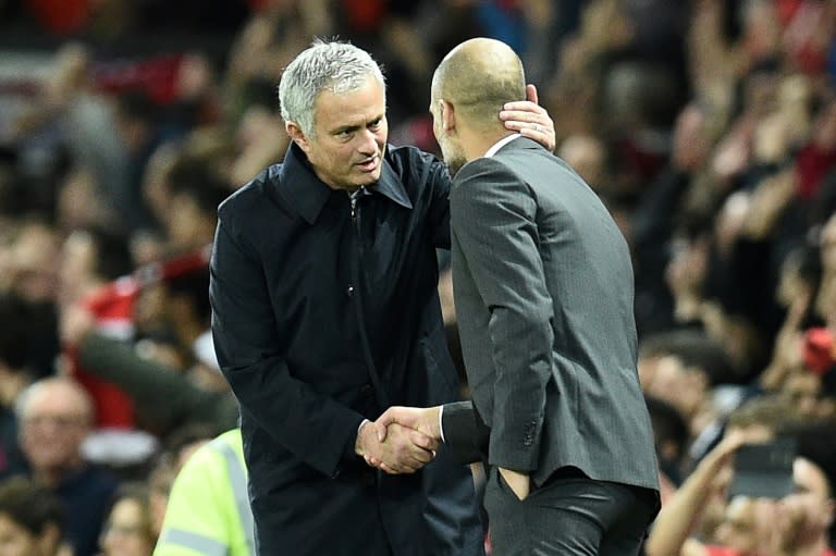 Manchester United's manager Jose Mourinho (L) shakes hands with Manchester City's counterpart Pep Guardiola after their English Football League Cup match, in October 2016