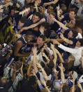 FILE - In this April 4, 2016, file photo, Villanova forward Kris Jenkins celebrate with fans after the NCAA Final Four college basketball championship game against North Carolina, in Houston. (AP Photo/Michael Simmons, File)