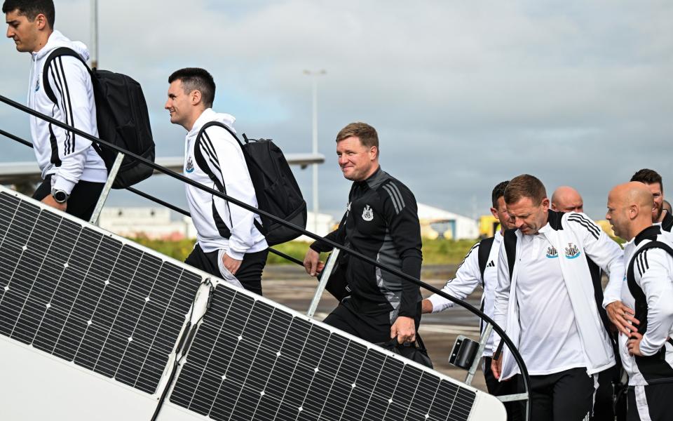 Eddie Howe (third left) and Newcastle depart for pre-season training in Germany