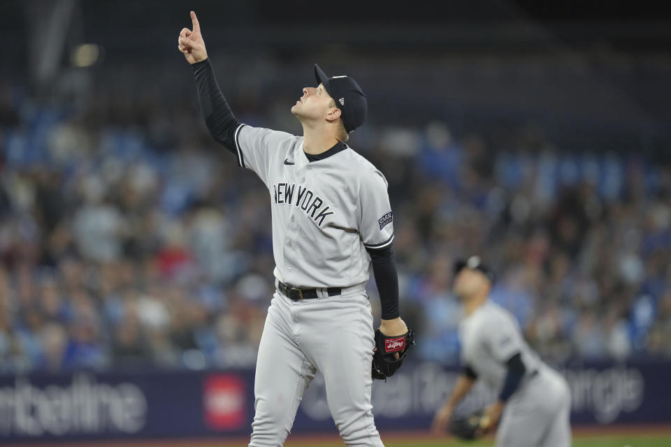 New York Yankees starting pitcher Michael King motions for a catch as Toronto Blue Jays' Cavan Biggio pops out to Yankees third baseman Isiah Kiner-Falefa during the second inning of a baseball game in Toronto on Tuesday, Sept. 26, 2023. (Chris Young/The Canadian Press via AP)