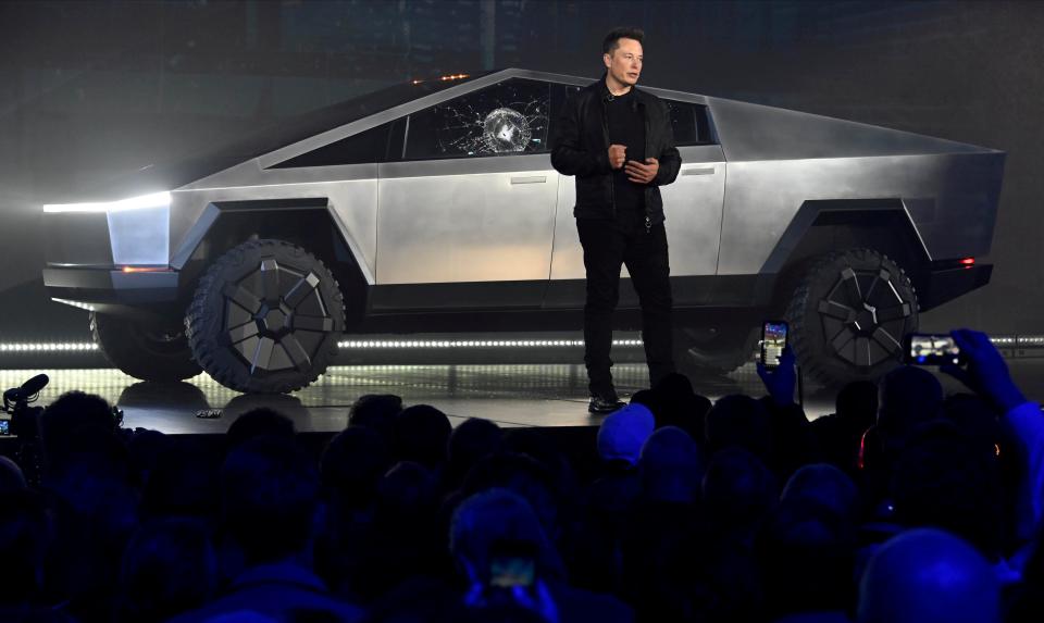 FILE PHOTO: Tesla CEO Elon Musk unveils the Cybertruck at the TeslaDesign Studio in Hawthorne, Calif. The cracked window glass occurred during a demonstration on the strength of the glass.Mandatory Credit: Robert Hanashiro-USA TODAY/File Photo