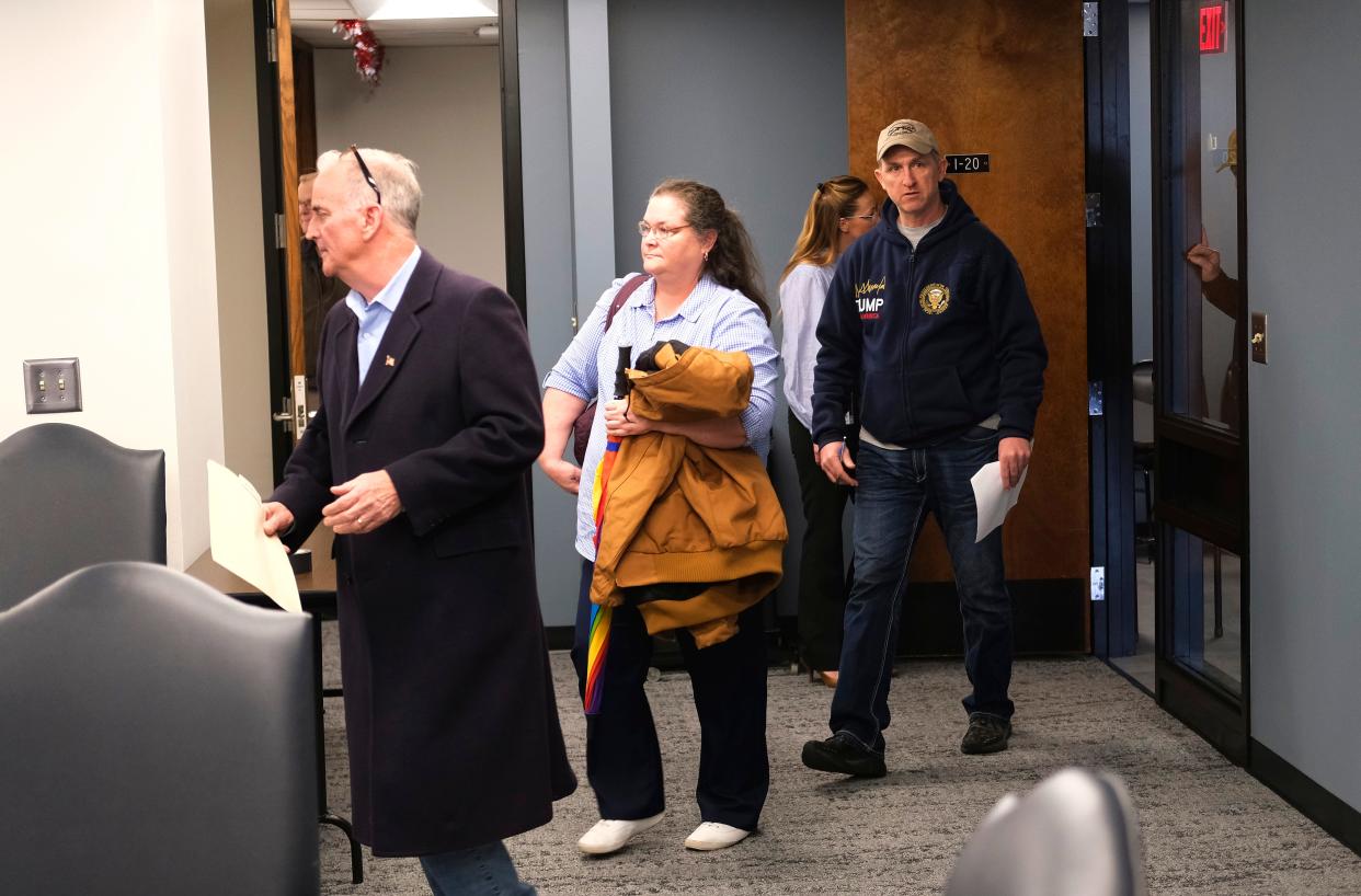 People file into the meeting room before the monthly meeting of the Oklahoma State Board of Education at the Oliver Hodge Building in the Capitol complex in Oklahoma City, Thursday, Dec. 21, 2023.