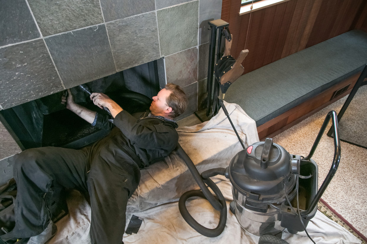 Professional cleaning a chimney