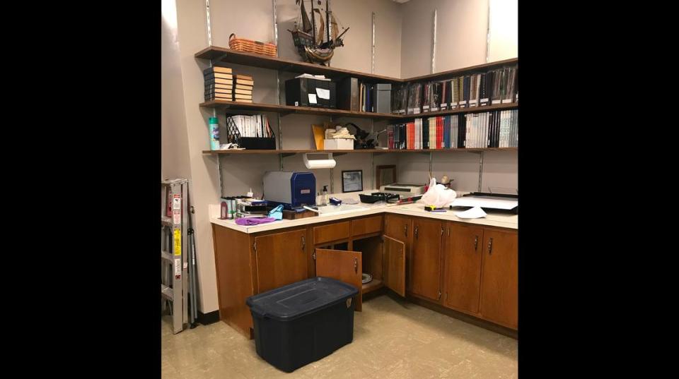 Before photo of a employee and public work space on the main level of Louis Latzer Library in Highland.