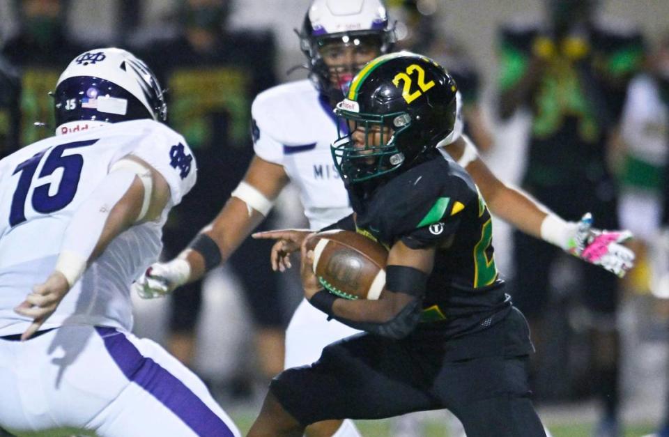 Roosevelt’s Dimareea Banks, right, finds an opening in the Mission Oak defense Friday, Sept. 1, 2023 in Fresno. Mission Oak won, 31-7.