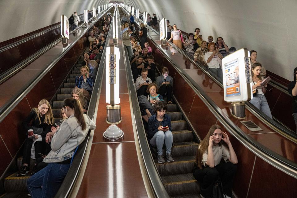 May 2023: People take cover at a metro station during a Russian rocket attack in Kyiv, Ukraine. Explosions have rattled Kyiv during daylight as Russian ballistic missiles fell on the Ukrainian capital. The barrage came hours after a more common nighttime attack of the city by drones and cruise missiles.