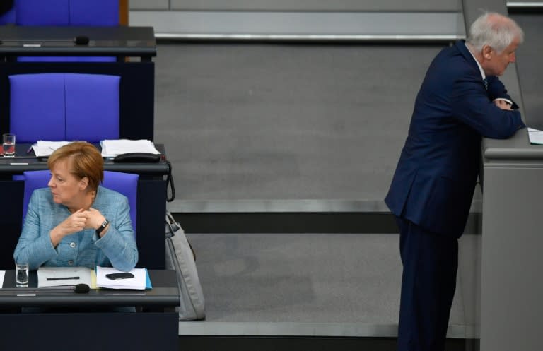 Merkel with Interior Minister Seehofer, who have seens deep rifts threaten their coalition