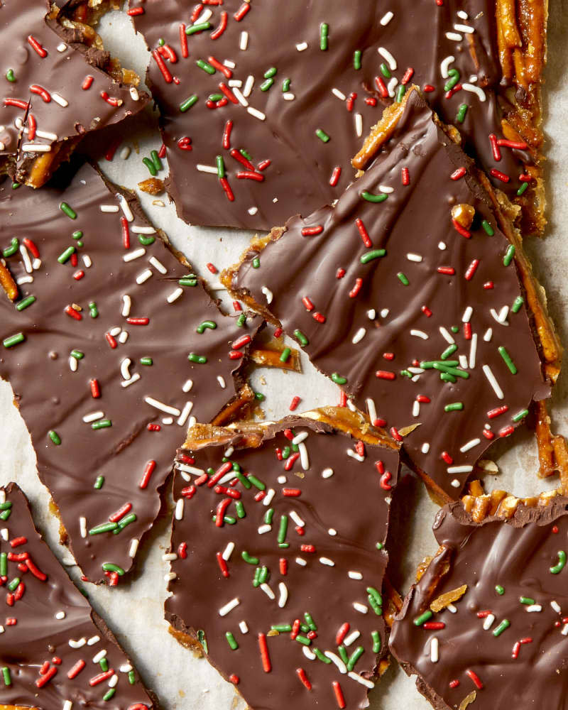 Overhead shot of pretzel toffee broken up on parchment paper.