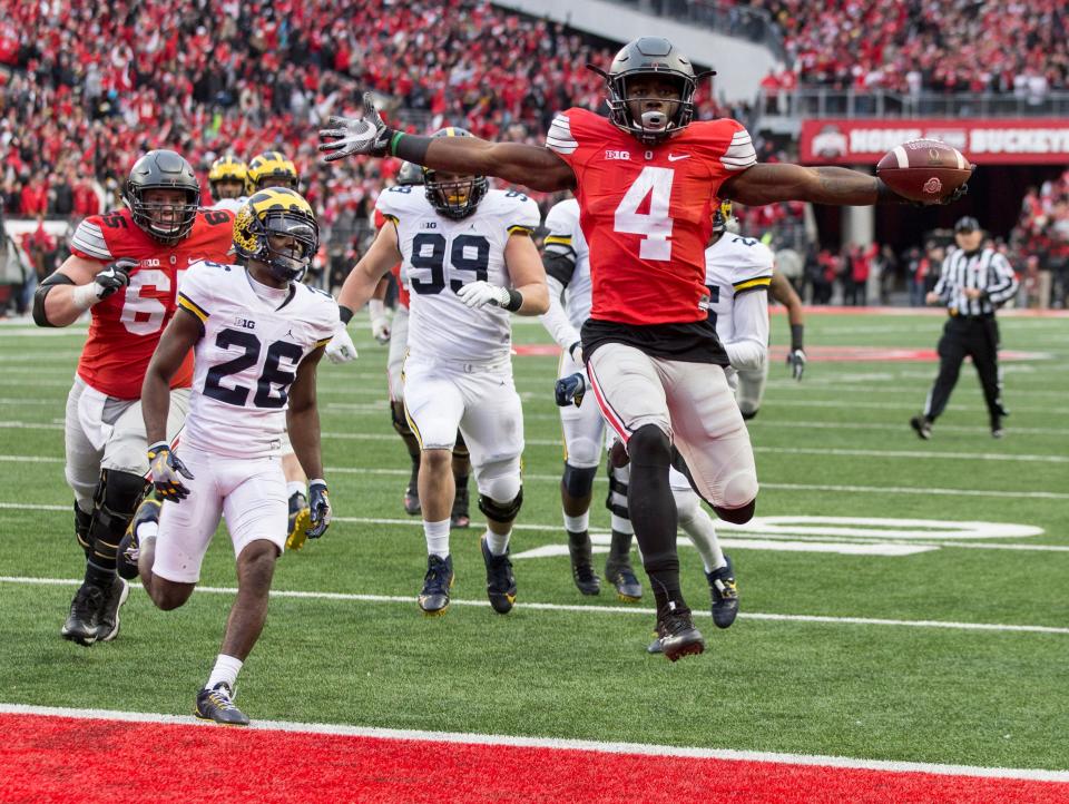 Ohio State running back Curtis Samuel (4) scores the winning touchdown in the second overtime against MIchigan in their 2016 game at Ohio Stadium.