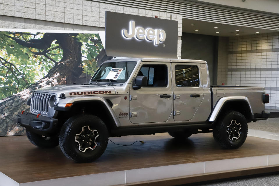 FILE- This Feb. 14, 2019, file photo shows a 2020 Jeep Gladiator on display at the 2019 Pittsburgh International Auto Show in Pittsburgh. The Jeep Gladiator boasts impressive off-road ability, a roomy rear seat and a high maximum towing capacity. (AP Photo/Gene J. Puskar, File)