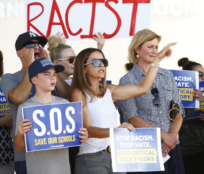 People yell in support during a protest against the teaching of critical race theory by Scottsdale Unified School District at Coronado High School in Scottsdale on May 24, 2021.