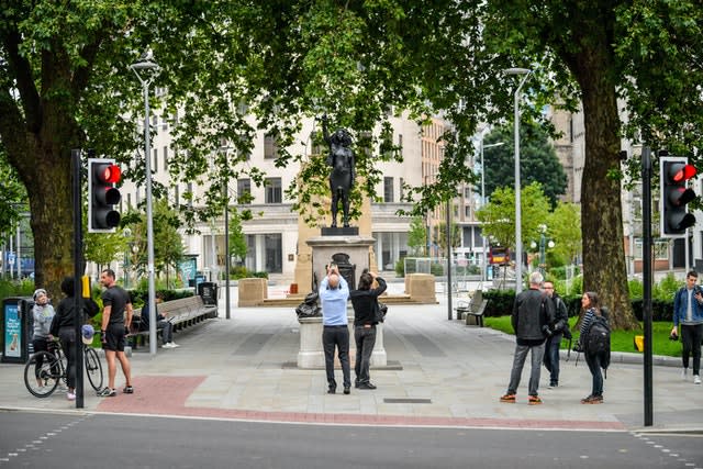 People photograph the piece (Ben Birchall/PA)