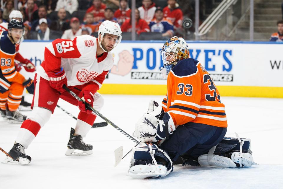 Goaltender Cam Talbot #33 of the Edmonton Oilers makes a save on Frans Nielsen #51 of the Detroit Red Wings at Rogers Place on November 5, 2017 in Edmonton, Canada.