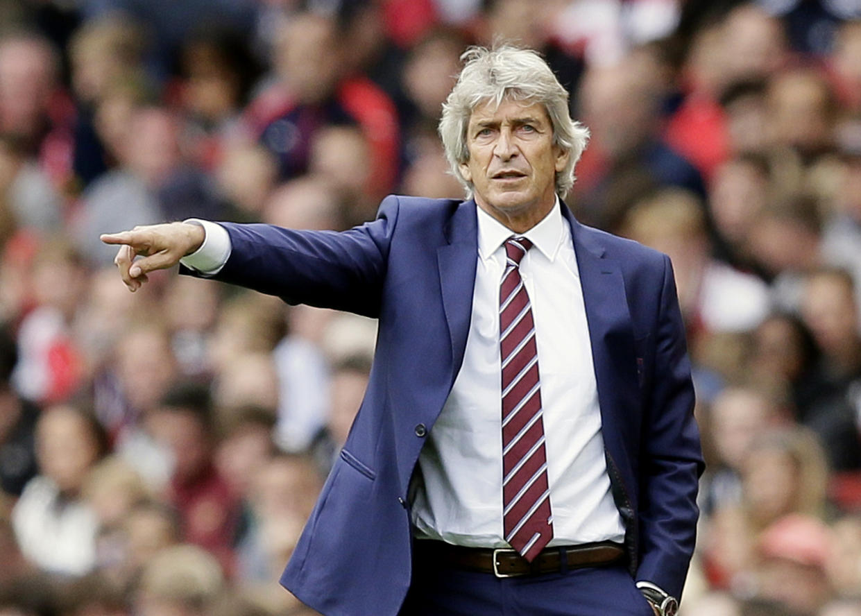 West Ham manager Manuel Pellegrini gives instructions during Arsenal v West Ham United at the Emirates Stadium.