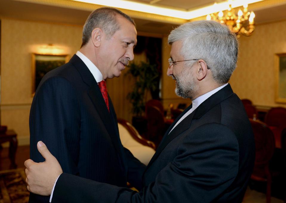 In this photo provided by Turkish Prime Minister's Press Service, Turkish Prime Minister Recep Tayyip Erdogan, left, greets Iran's chief nuclear negotiator Saeed Jalili before a meeting in Ankara, Turkey, Tuesday, Sept. 18, 2012. Iran on Tuesday urged Western powers to engage in “purposeful” negotiations as top EU and Iranian representatives prepared to meet for talks on restarting stalled negotiations over Tehran's nuclear program. The EU's Foreign policy Chief Catherine Ashton and Jalili are meeting in Istanbul later on Tuesday. (AP Photo/Yasin Bulbul, Prime Minister's Press Service)