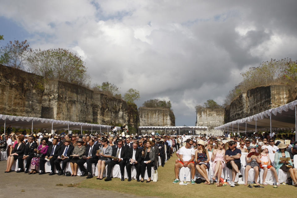 People attend a memorial service marking the 10th anniversary of the 2002 Bali bombings terrorist attacks at nightclubs in Kuta that killed 202 people, including 88 Australians and seven Americans, in Jimbaran in Bali, Indonesia, Friday, Oct. 12, 2012. (AP Photo/Made Nagi, Pool)