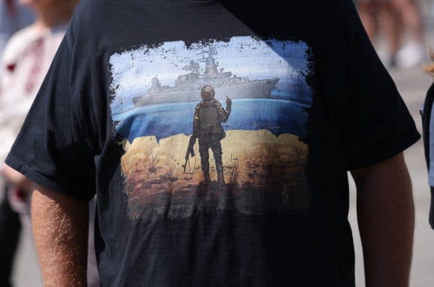 A participant wears a t-shirt that celebrates the Ukrainian soldiers on Snake Island who refused to surrender to Russian naval forces during a protest gathering to demand Europe keep its promises towards supporting Ukraine on 5 June 2022 in Berlin, Germany (Getty Images)