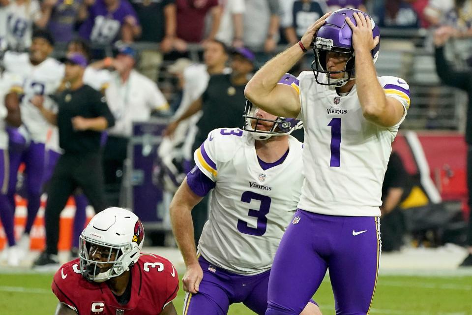 Minnesota Vikings kicker Greg Joseph reacts to missing a last second field goal as teammate Jordan Berry 3, and Arizona Cardinals Budda Baker 3, look on during a football game Sunday, Sept 19, 2021, in Glendale, AZ.