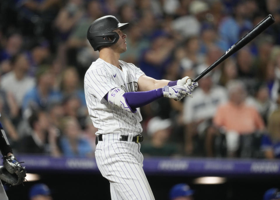 Colorado Rockies' Nolan Jones follows the flight of his three-run home run off Toronto Blue Jays relief pitcher Genesis Cabrera in the sixth inning of a baseball game Friday, Sept. 1, 2023, in Denver. (AP Photo/David Zalubowski)