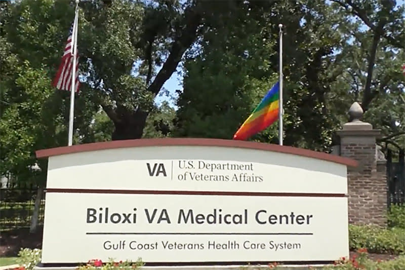 A Pride flag flies with U.S. flags at the entrance to the Biloxi VA Medical Center and the Biloxi VA Veterans Cemetery in Biloxi, Miss., on June 5, 2023. (WXXV)