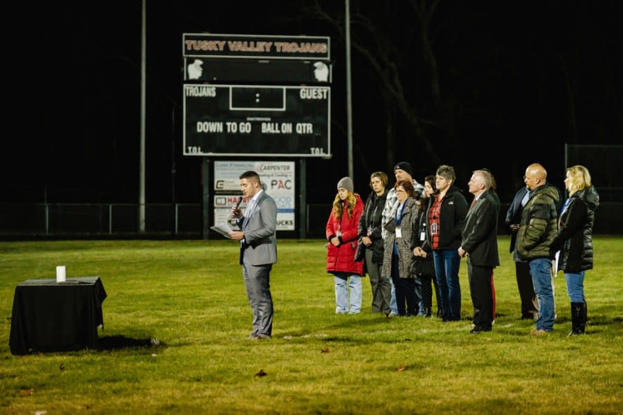 Derek Varansky, superintendent of Tuscarawas Valley School, speaks during a community prayer vigil, Tuesday, Nov. 14, 2023, at the football stadium in Zoarville, Ohio. A charter bus filled with high school students was rear-ended by a semitruck on an Ohio highway earlier in the day, leaving several people dead and multiple others injured. (Andrew Dolph/Times Reporter via AP)