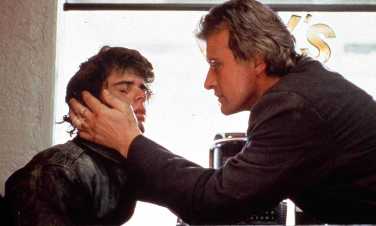 <span>‘The moments he improvised were unexpected gifts’ … Hauer and C Thomas Howell with pennies on his eyes, in the 1986 cult hit.</span><span>Photograph: Studiocanal Films Ltd/Alamy</span>