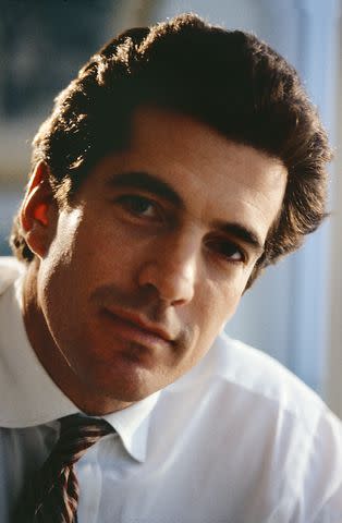 <p>Anne Marie Fox</p> John F. Kennedy Jr. photographed at 'George Magazine' Headquarters in New York City in 1996.