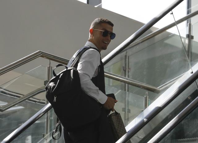 Cristiano Ronaldo spotted looking glum at Moscow airport as he