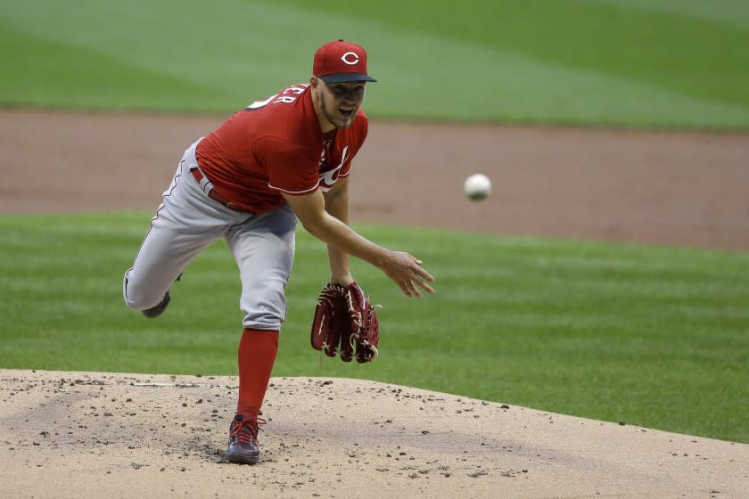 Cincinnati Reds' Trevor Bauer pitches during the first inning of a baseball game against the Milwaukee Brewers.
