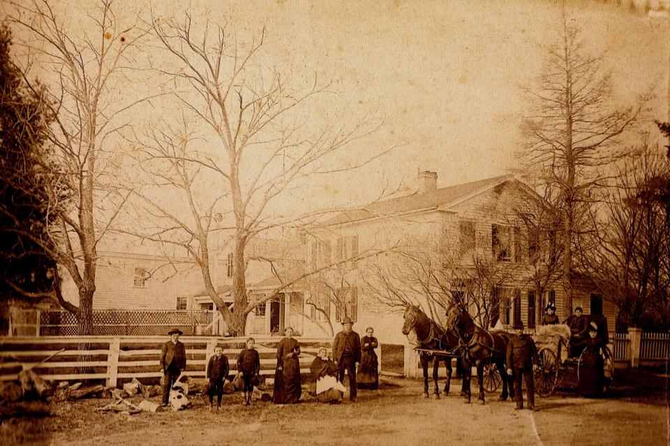 The Eberhardt family in front of their farmhouse on Plank Road, town of Manitowoc Rapids, circa 1880s.