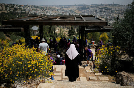 Palestinian visitors gather at a look-out point on the Armon Hanatziv Promenade in Jerusalem May 11, 2017. Picture taken May 11, 2017. REUTERS/Amir Cohen