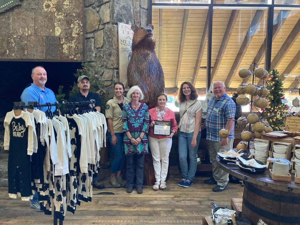 Members of the Smoky Mountains BearWise Community Taskforce visit the Bodacious Bear at Nantahala Outdoor Center in Gatlinburg. From left to right: Matt Auberle of Pink Jeep Tours, Dan Gibbs and Janelle Musser of Tennessee Wildlife Resources Agency, Frances Figart, Laurel Rematore, and Emma DuFort of Great Smoky Mountains Association, and Rich Wilson of Ober Gatlinburg.