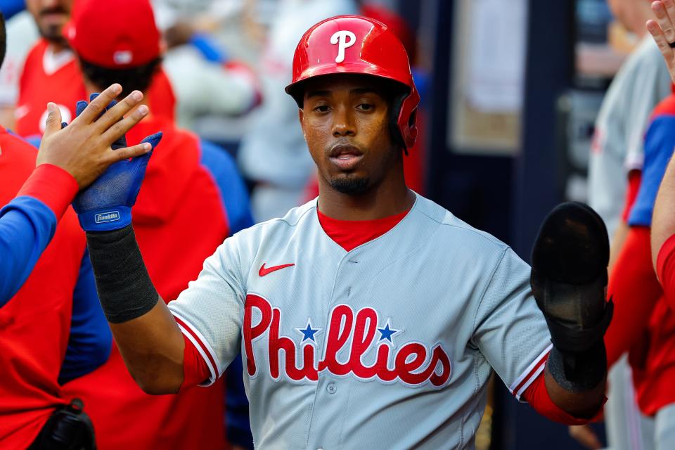 Philadelphia Phillies Jean Segura reacts after scoring in the second inning of a baseball game against the Atlanta Braves, Tuesday, May 24, 2022, in Atlanta. (AP Photo/Todd Kirkland)