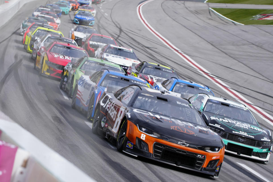 Kyle Busch (8) drives into Turn One during the NASCAR auto race at Atlanta Motor Speedway Sunday, Feb. 25, 2024, in Hampton , Ga. (AP Photo/John Bazemore)