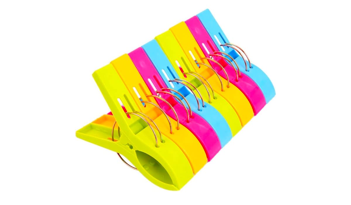 A set of colorful beach clips to secure your towel