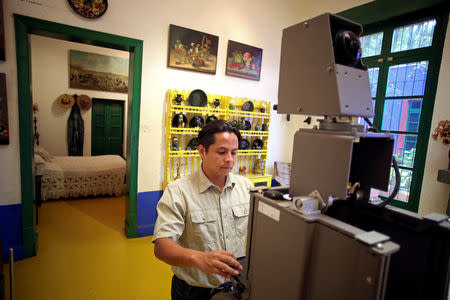 A Google employee maps the dining room of the childhood home of Mexican artist Frida Kahlo, now Frida Kahlo Museum, also known as "Casa Azul", in Mexico City, Mexico May 21, 2018. Picture taken May 21, 2018. REUTERS/Gustavo Graf