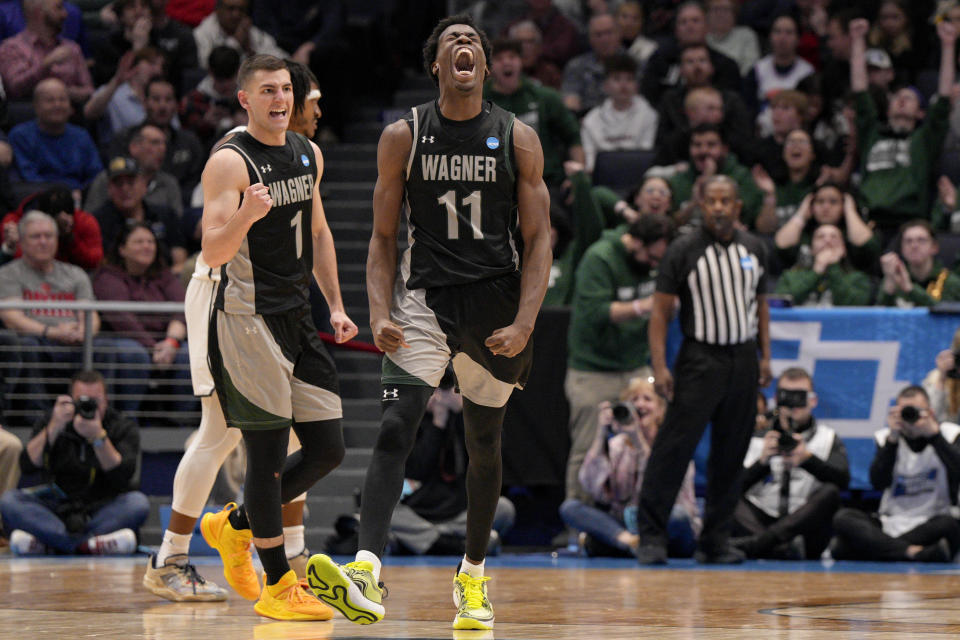 Wagner's Melvin Council Jr. (11) reacts after scoring against Howard during the second half of a First Four college basketball game in the men's NCAA Tournament, Tuesday, March 19, 2024, in Dayton, Ohio. (AP Photo/Jeff Dean)