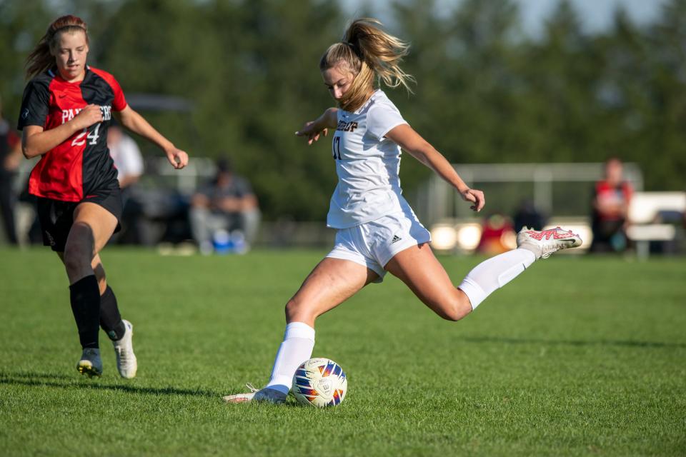 Brebeuf Jesuit Preparatory High School junior Josie Studley (17) shoots, and scores, during the first half of a Marion County Girls’ Soccer championship game against North Central High School, Saturday, Sept. 24, 2022, at North Central High School.