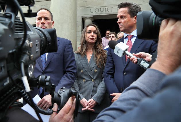 Karen Read appears with her attorney Alan Jackson (right) outside the Norfolk County Superior Court after the pretrial hearing on May 3. 